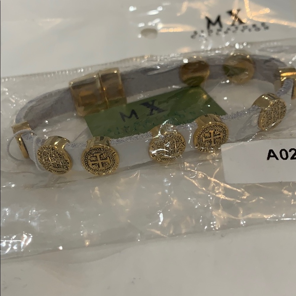 Blue bracelet with gold charms with designs